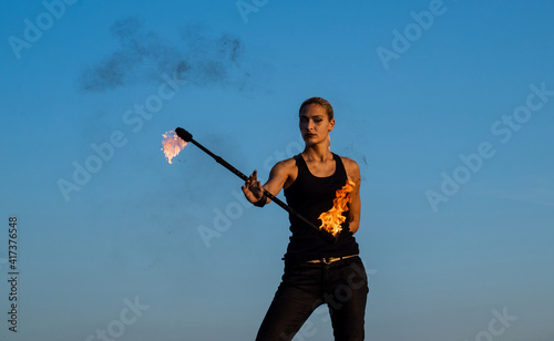 Total dedication for flame. Baton twirling. Fire performance. Outdoor show. Evening party