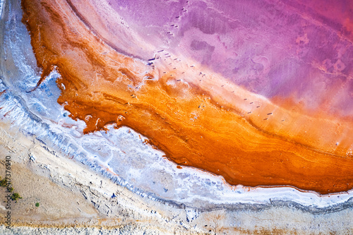 Fototapeta Naklejka Na Ścianę i Meble -  Abstract view of pink lake salt water from drone. Creative nature color concept. Top view background