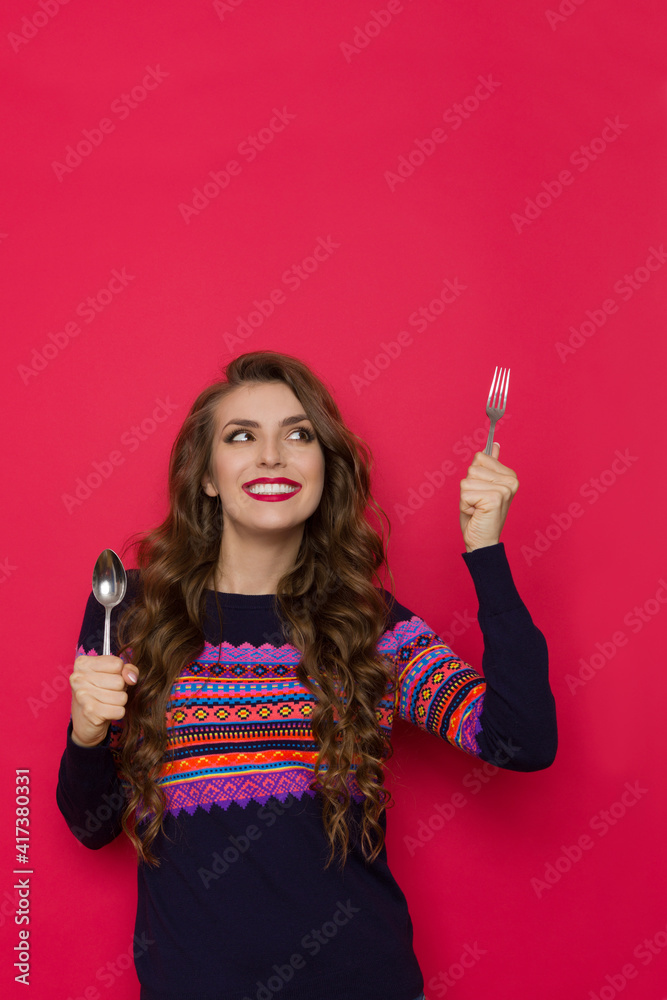 Smiling Young Woman Is Holding Fork And Spoon