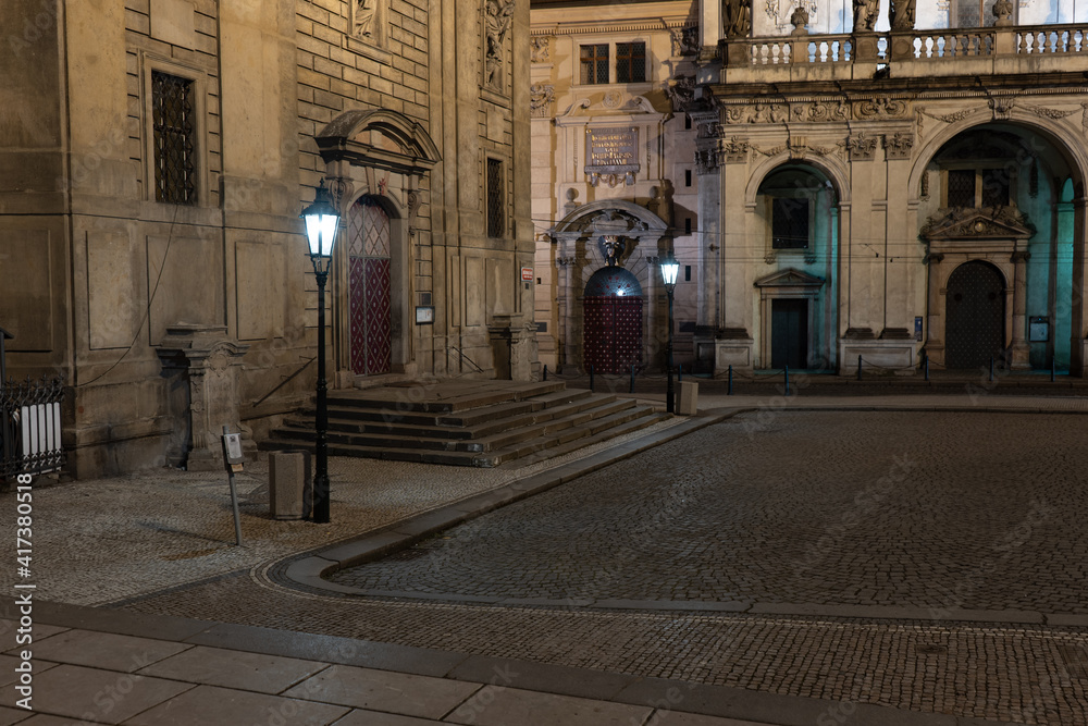 street lamp on the pavement in the old town of prague at night