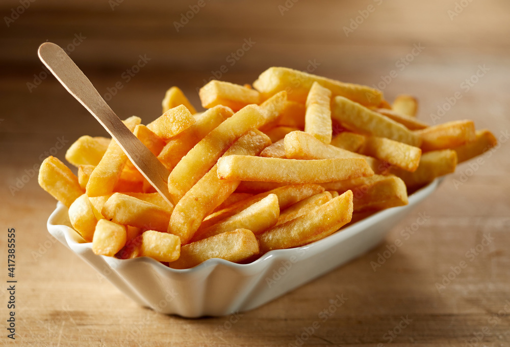 Delicious French fries with zero waste fork in bowl Delicious French fries with zero waste fork in bowl