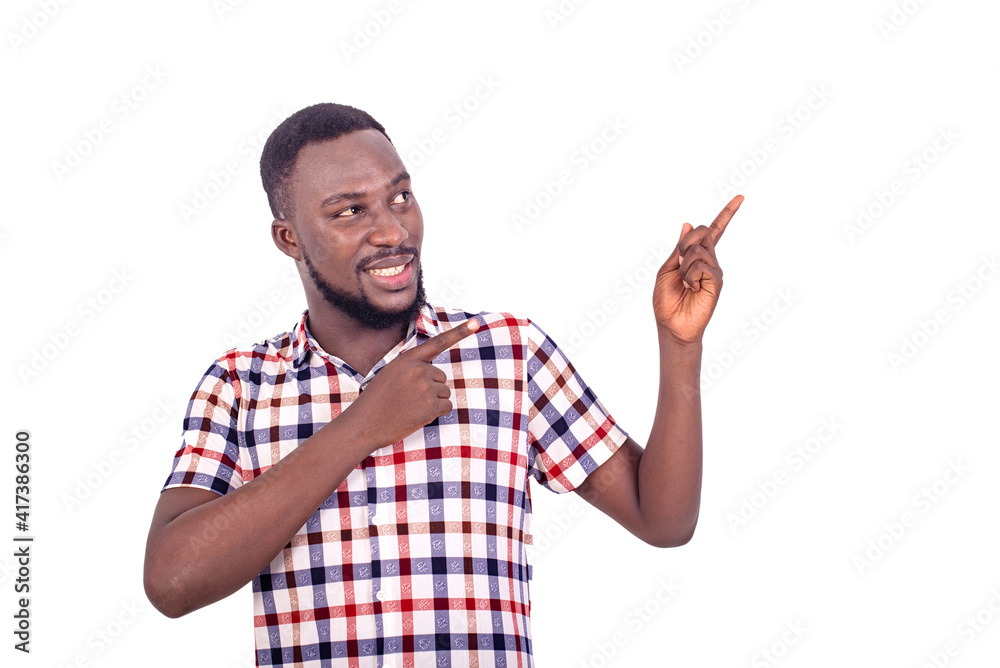 portrait of a handsome young man showing something, smiling. portrait of a handsome young man showing something, smiling.