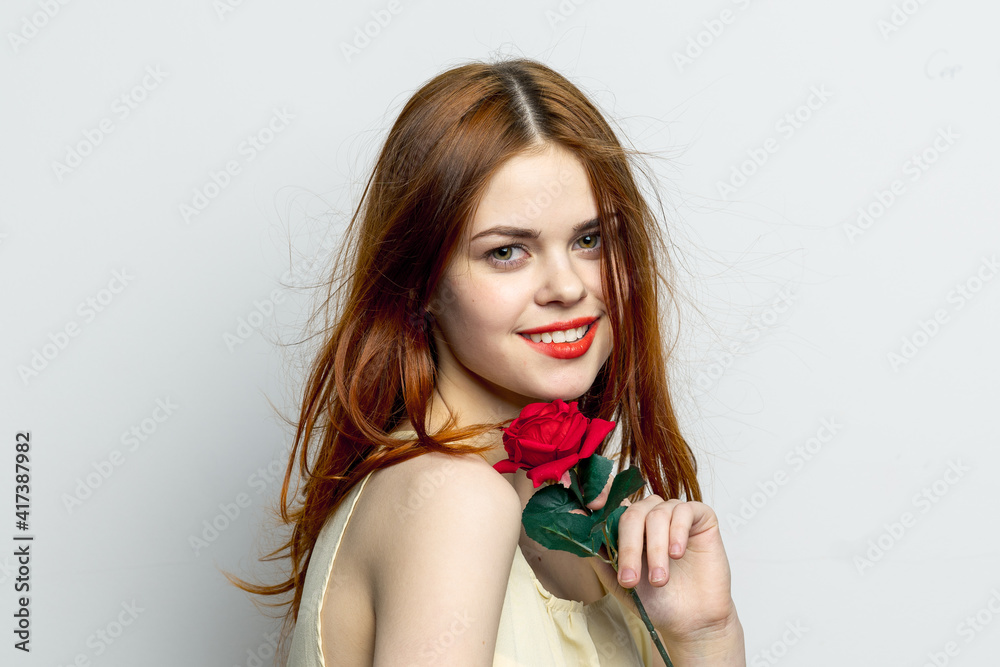 smiling woman holding rose flower in hands charm red lips attractive look smiling woman holding rose flower in hands charm red lips attractive look