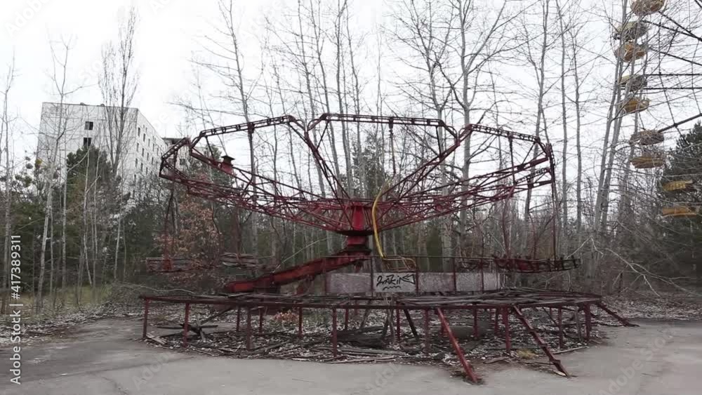 Abandoned carousel and abandoned ferris at an amusement park in the ...