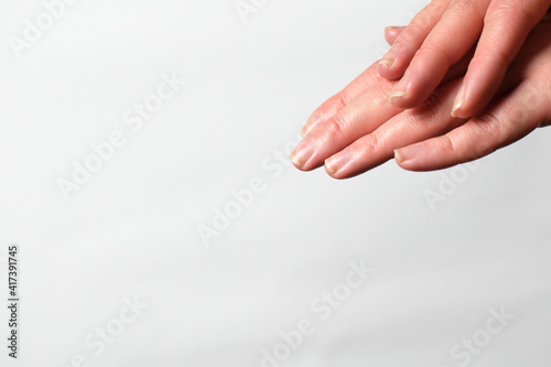 Female Hands Natural Manicure White Background Applying Moisturizer Hand