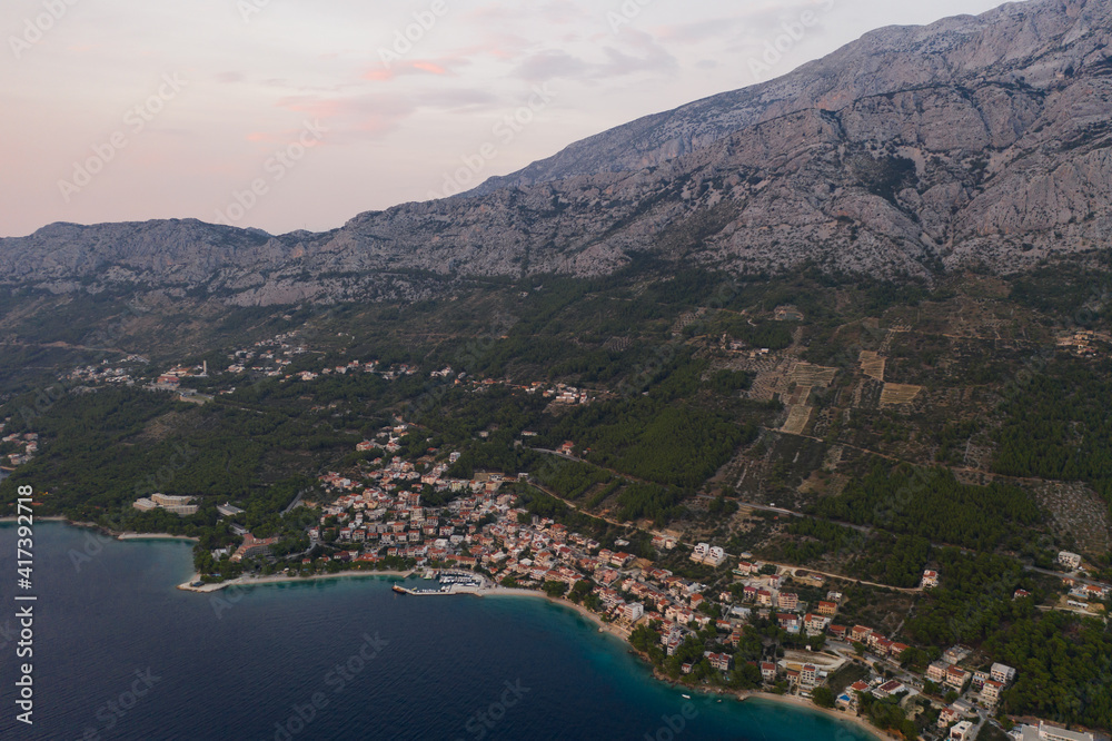 Famous Adriatic coast. Panoramic aerial view of picturesque coastline in Makarska riviera, Brela, Croatia, Europe. Splendid Adriatic sea, mountains and a village by the sea. Breathtaking landscapes.