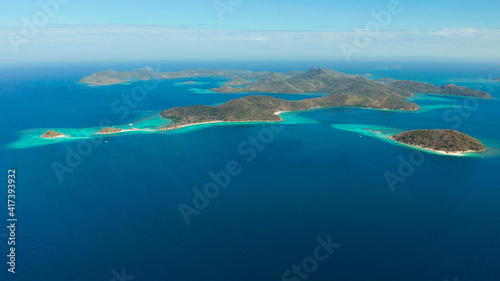 aerial seascape Lagoons with blue, azure water in middle of small islands. Palawan, Philippines. tropical islands with blue lagoons, coral reef. Islands of the Malayan archipelago with turquoise