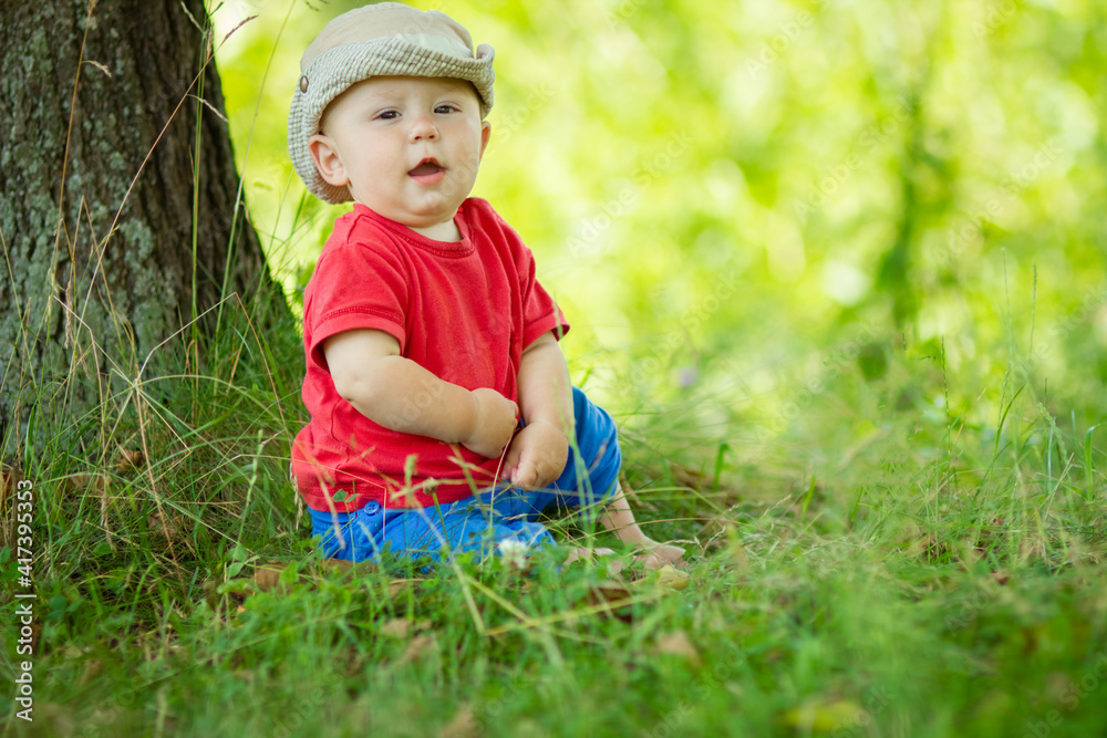 A happy child having fun playing in the nature park A happy child having fun playing in the nature park