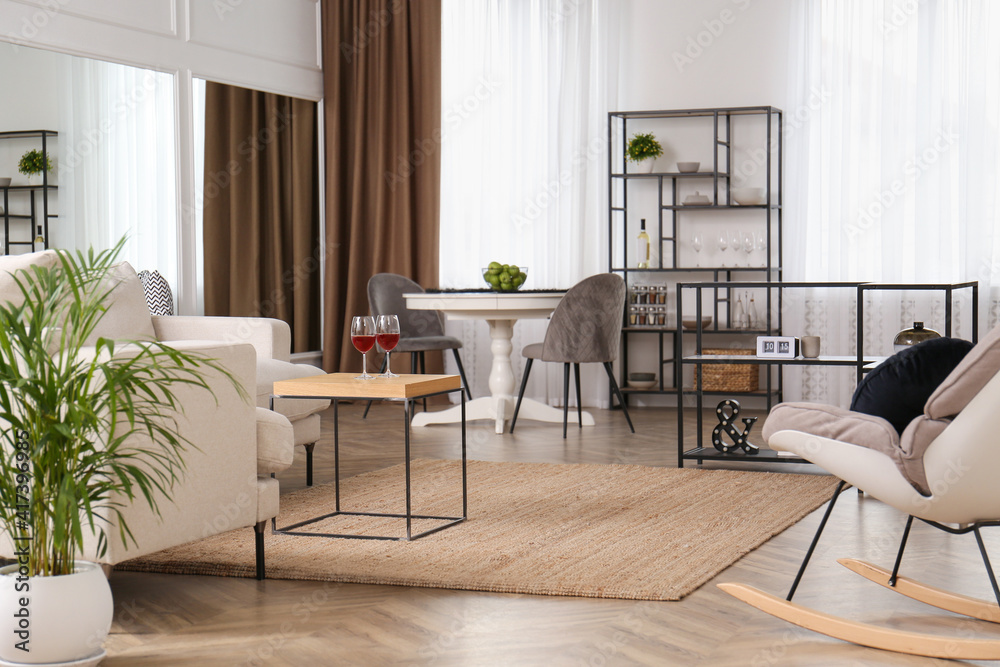 Fototapeta premium Stylish living room interior with comfortable sofa