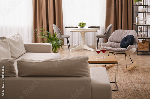 Stylish living room interior with comfortable sofa