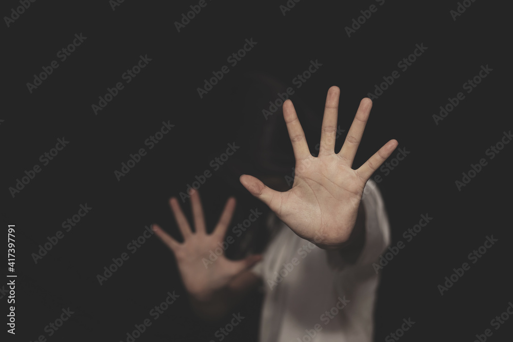 woman raised her hand for dissuade, campaign stop violence against women. International Women's Day woman raised her hand for dissuade, campaign stop violence against women. International Women's Day