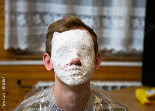 Gypsum on mans face during art workshop, Sulejow, Lodzkie, Poland photo