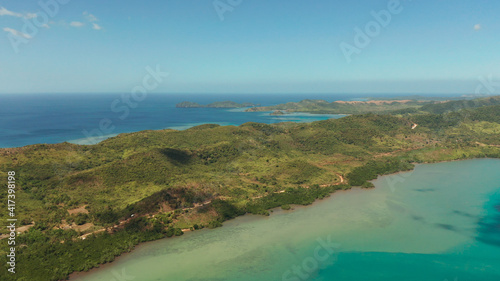 aerial view small island group in province of Palawan. Busuanga, Philippines. Seascape, islands covered with forest, sea with blue water. tropical landscape, travel concept