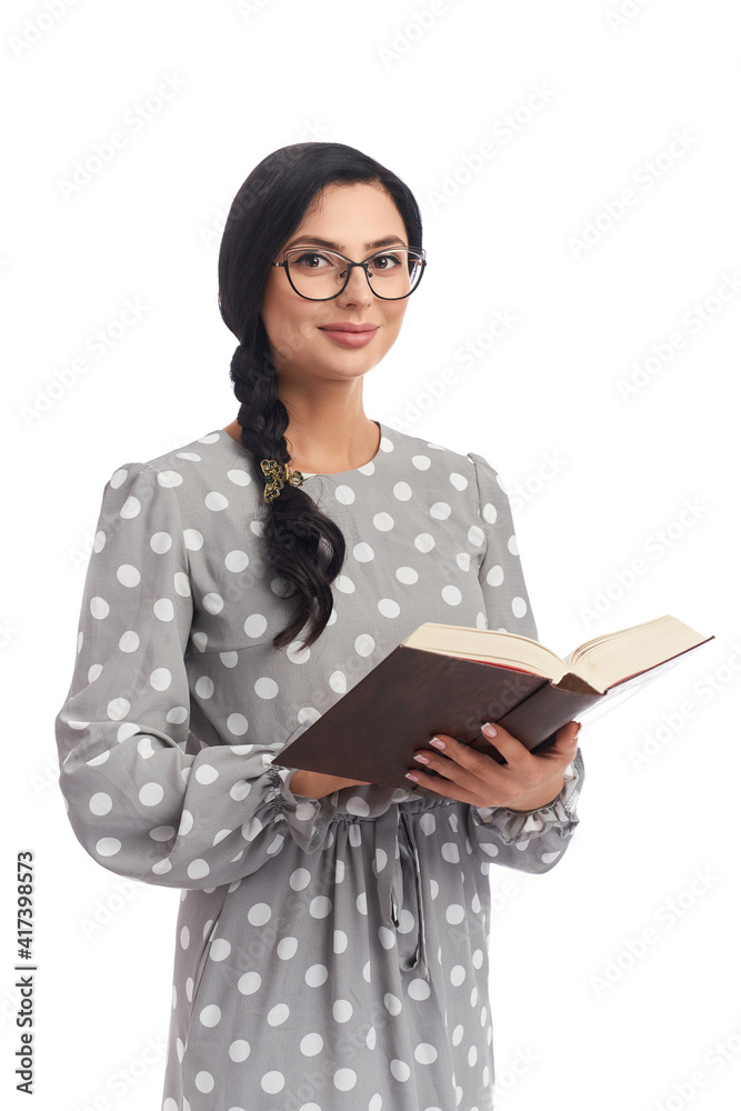 Attractive lady in eyeglasses reading book in studio Attractive lady in eyeglasses reading book in studio