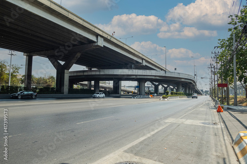 road in city with grand motorway construction and vehicel traffic