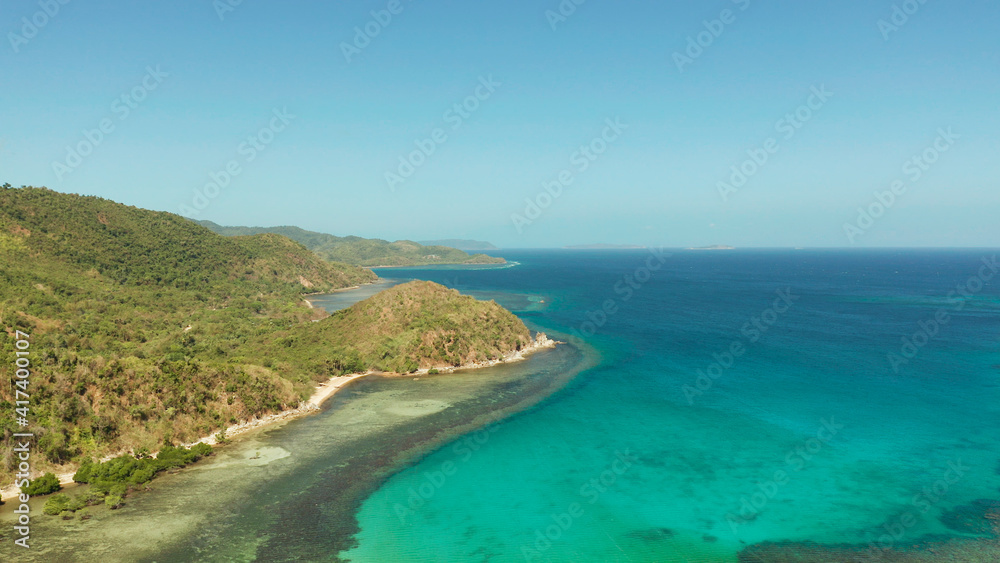 Aerial view coastline of a tropical island with coral reef and blue lagoon. Busuanga, Palawan, Philippines. tropical landscape