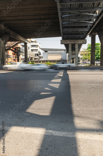 construction pier under highway while vehicle movement on road with shadow lighting on under cross bridge © nationkp