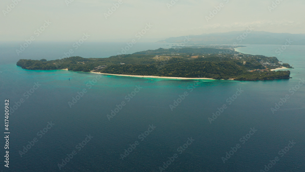 Tropical island Boracay with sandy beach and hotels view from the sea, aerial view. Summer and travel vacation concept. Philippines