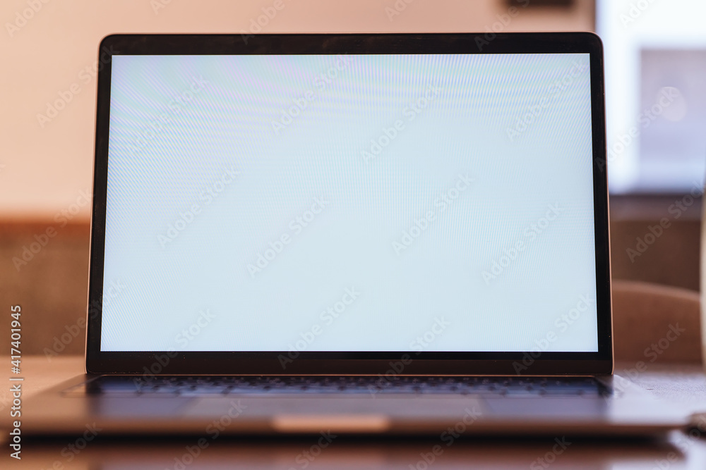 Conceptual workspace, Laptop computer with blank white screen on table, blurred background. use in Traditional Chinese Alphabet operating system. Conceptual workspace, Laptop computer with blank white screen on table, blurred background. use in Traditional Chinese Alphabet operating system.