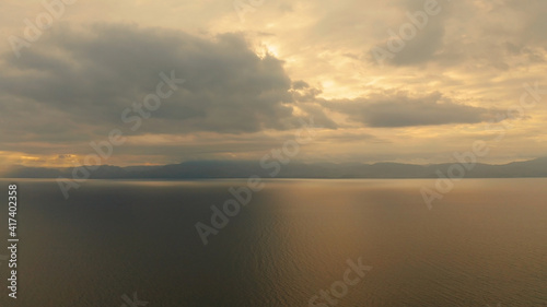 Beauty of colorful sky during the sunset from above. Beautiful sunset background from the colorful beams on the sky. Sunset over ocean. Seascape, Summer and travel vacation concept © Alex Traveler
