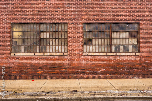 Vintage red brick industrial building with frosted windows in urban Chicago