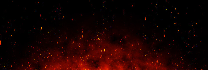 Fire embers particles over black background. Fire sparks background. Abstract dark glitter fire particles lights.	