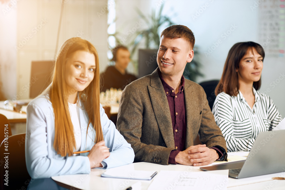 Group of young business people are working in modern office. Freelancers in coworking place. Creative and stylish youth. Group of young business people are working in modern office. Freelancers in coworking place. Creative and stylish youth.