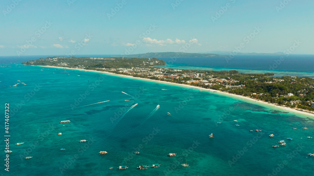 Tropical beach with tourists and clear blue sea, top view. Summer and travel vacation concept. Boracay, Philippines