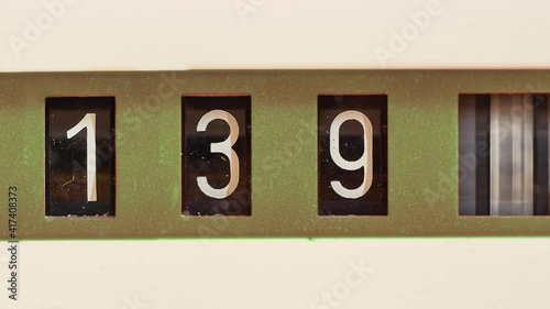 Mechanical counter, industrial flow meter for gas or water consumption or vintage odometer for an old truck dashboard photo