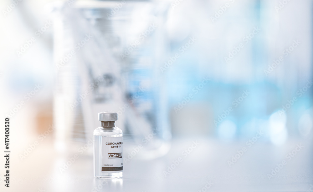coronavirus covid-19 vaccine bottle background ,vaccination concept .