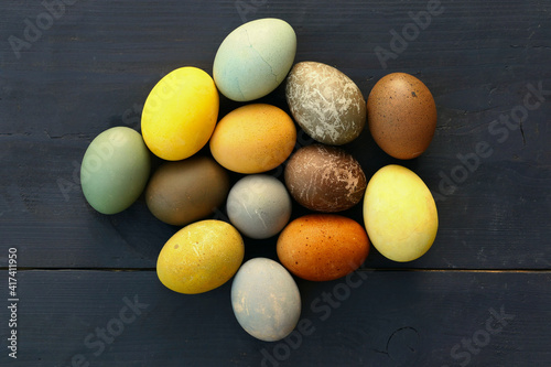 Easter eggs collection on wooden background. Natural dyed Easter eggs.