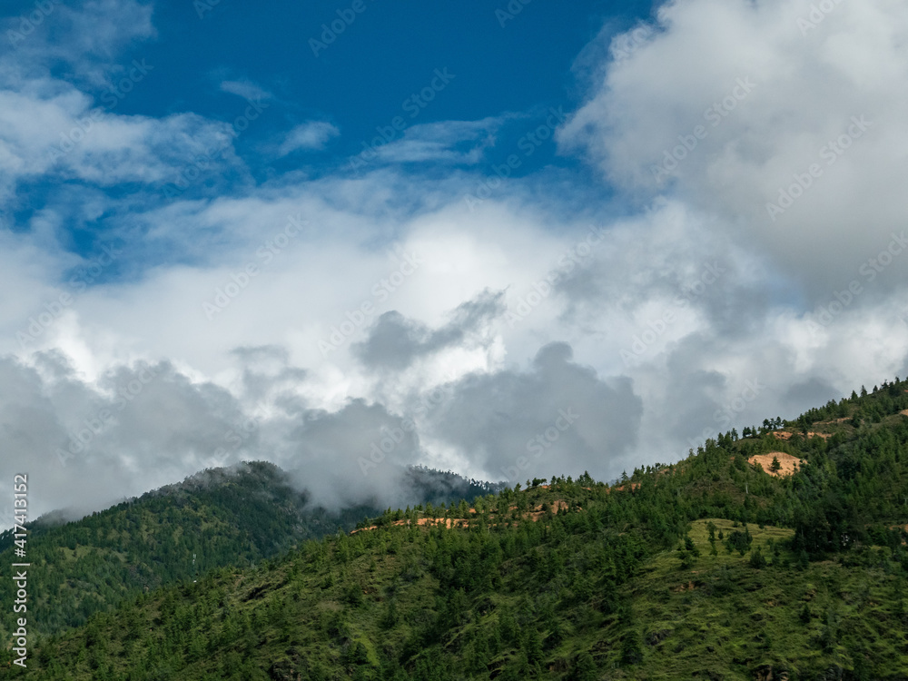 clouds over the mountains in Paro, Bhutan