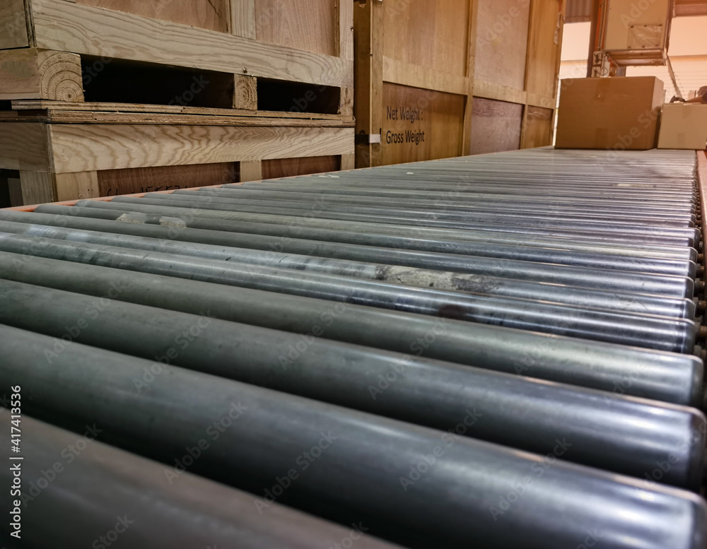 Worker sorting shipment cartons box on pallets and wooden case on hand lift in interior warehouse cargo for export and sorting goods in freight logistics transportation industrial, delivery service