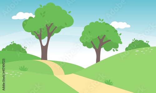 Spring landscape in countryside with green meadow on hills and blue sky,
