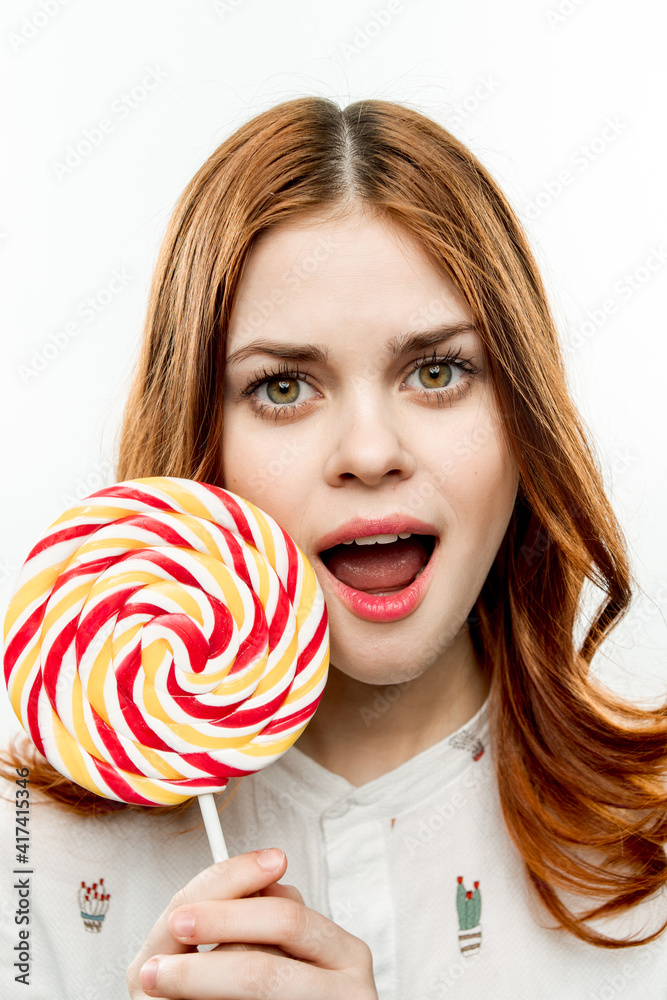 woman holding multicolored lollipop sweets emotions dessert