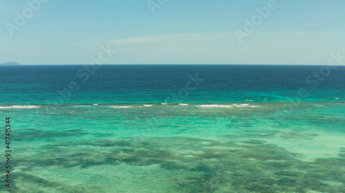 Sea water surface in lagoon  copy space for text  aerial view. Top view transparent turquoise ocean water surface. background texture