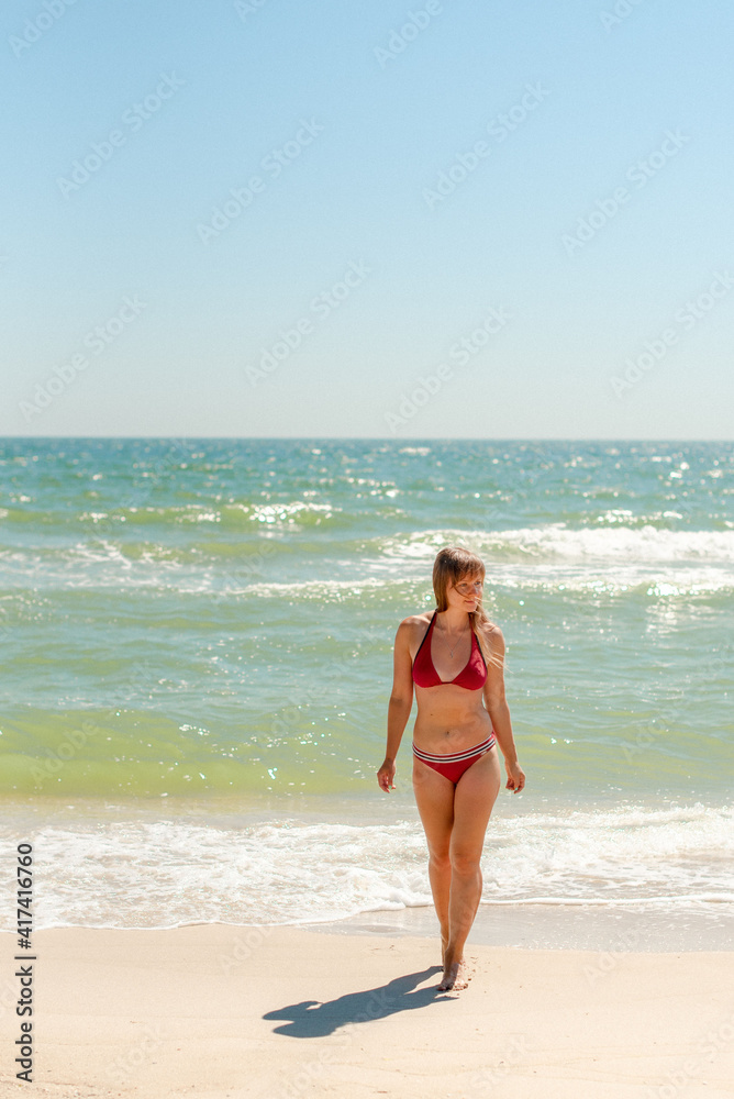 Young woman relaxing on a beach Young woman relaxing on a beach