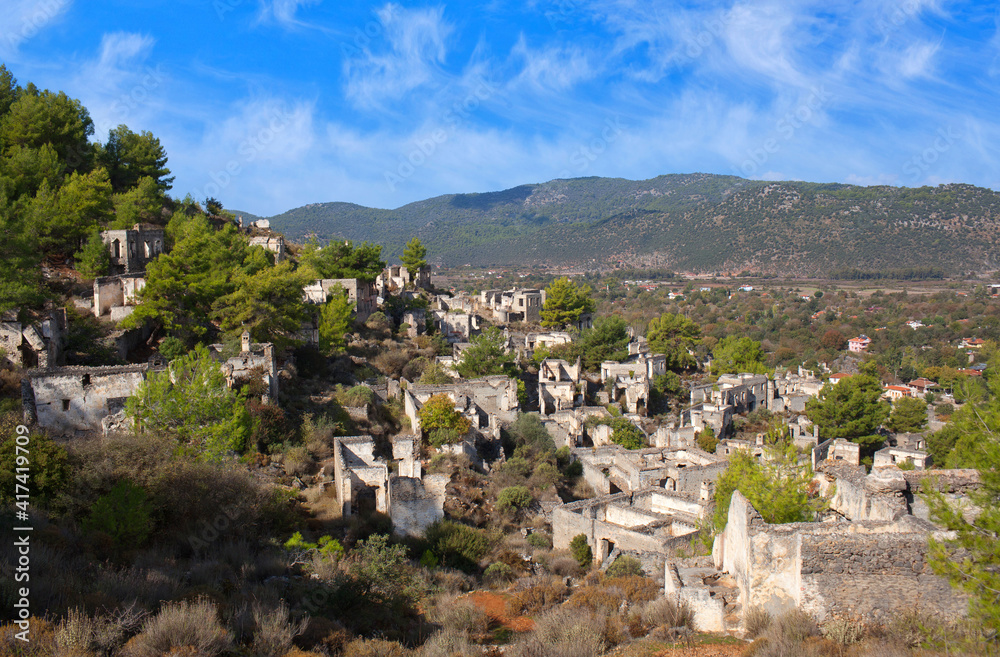 Abandoned village of Kayakoy on Lycian Way in Mugla province, Turkey. Kayakoy, anciently known as Lebessos and later pronounced as Livissi is a village 8 km south of Fethiye.