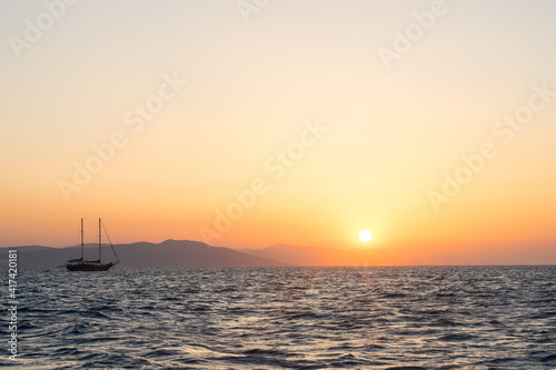 sailboat at sunrise