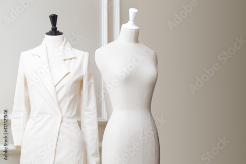 Tailor's textile mannequin in clothes designer show room photo