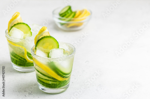 Refreshing mocktails, lemon cucumber summer drinks. Space for text.