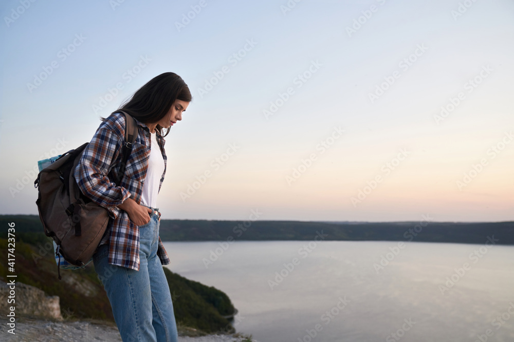 Pleasant woman hiking alone at national park Podillya Tovtry
