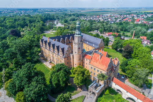 Castle in Oleśnica in Poland. Historical building with an interesting architect. Photo from a drone on a sunny day.
