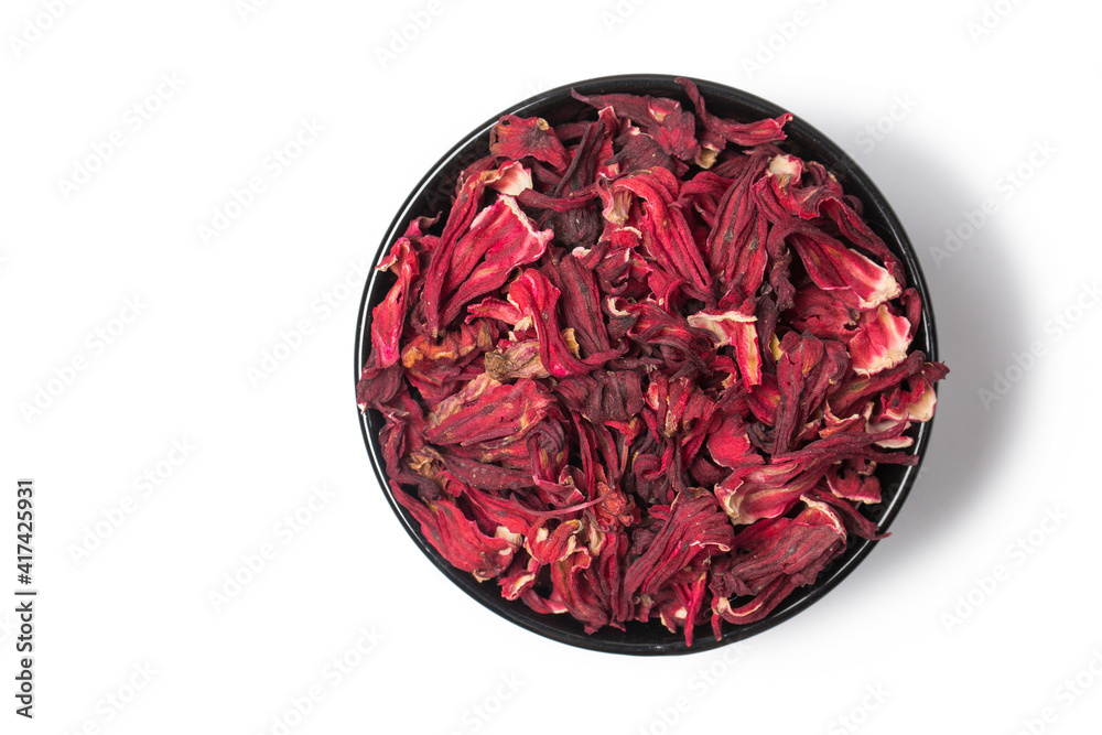 Fototapeta premium Red tea hibiscus in spoon isolated on white in studio
