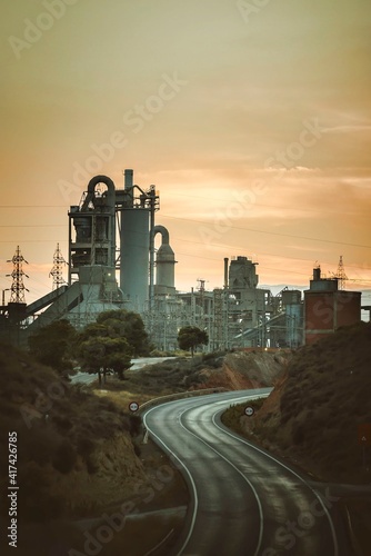 Sunset view of an industrial factory dedicated to cement manufacture