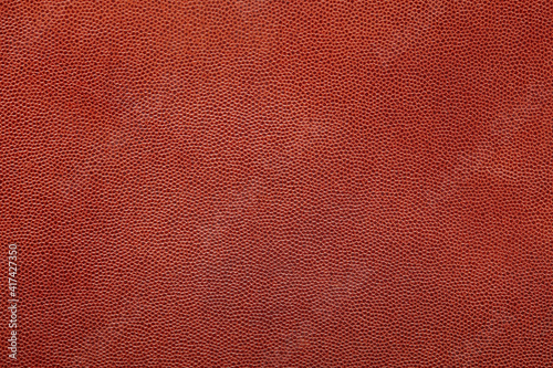 Brown fine grain leather texture background © andersphoto