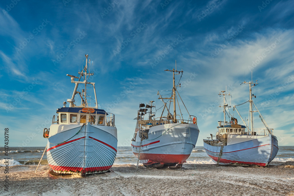 Coastal fishing boats vessels at Thorup beach in Western Denmark Coastal fishing boats vessels at Thorup beach in Western Denmark