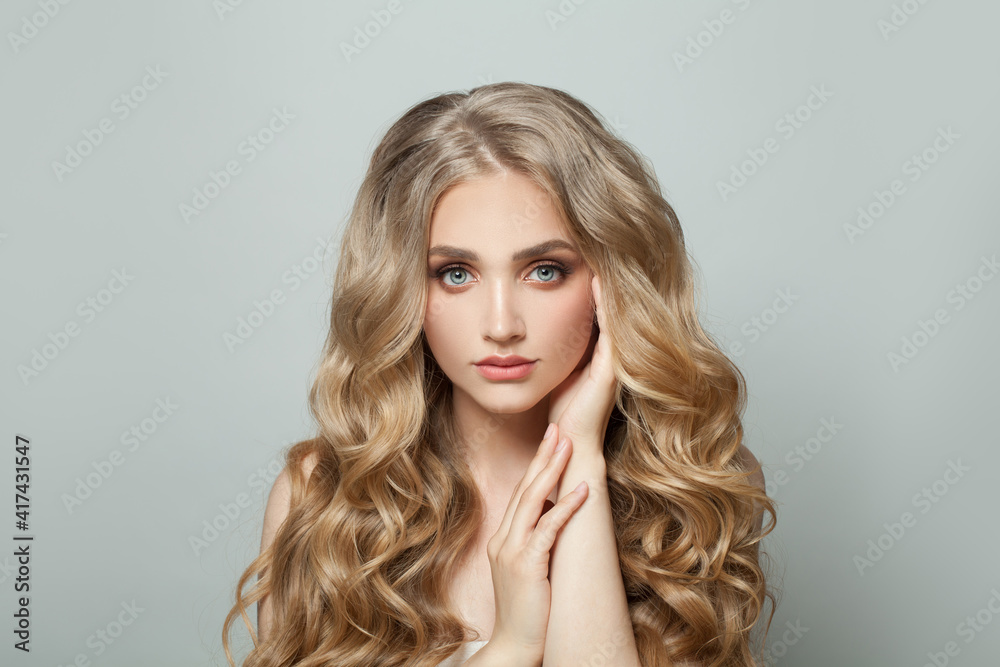 Young woman with healthy curly hairstyle portrait Young woman with healthy curly hairstyle portrait