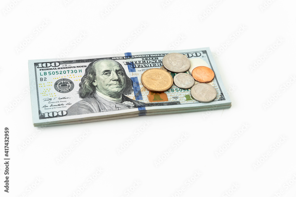 Fototapeta premium US money on white. Coins and 100 dollar bills.