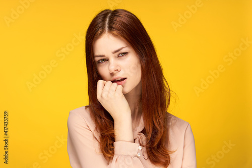 pretty woman attractive look emotions fashion isolated yellow background